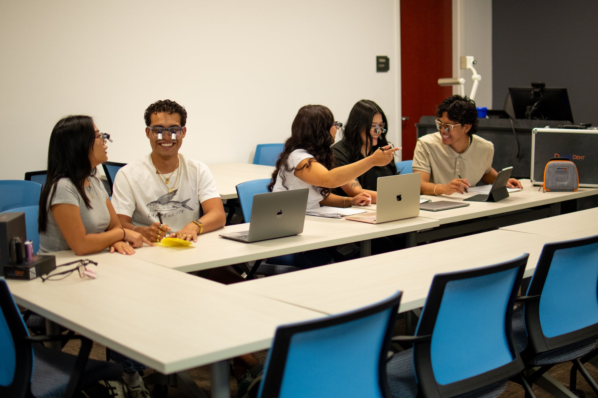 Dental Student wear LumaDent Ergo Loupes. 
